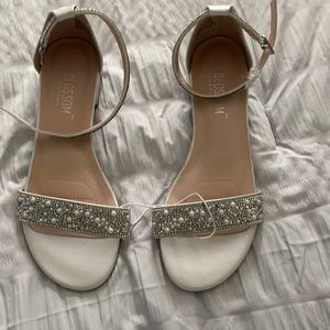 NWOT. Crystal embellished straps flat satin sandals size 7 from David’s Bridal.